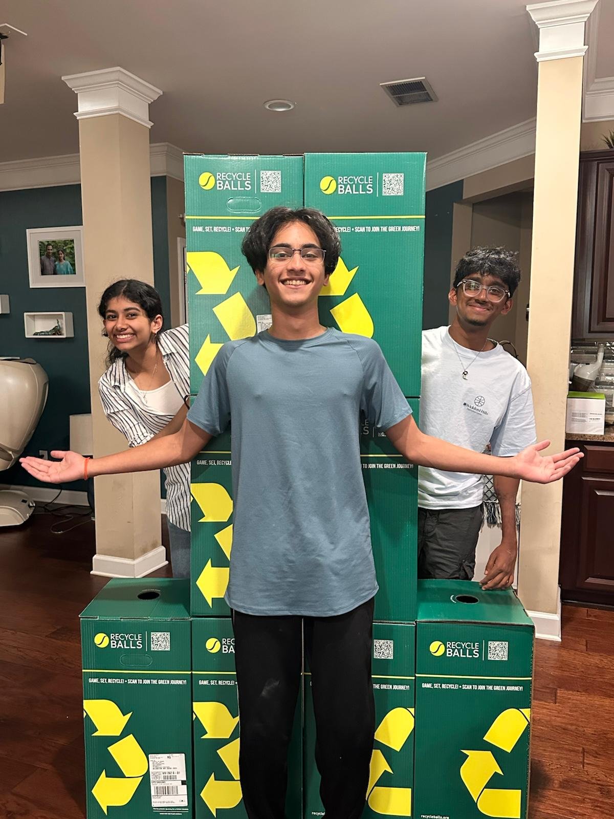 Youth volunteers with Recycle Balls collection boxes
